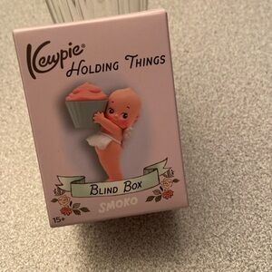 Kewpie holding things